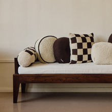 Load image into Gallery viewer, Cream wool bouclé round piped cushion on daybed - handmade in UK