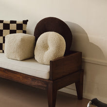 Load image into Gallery viewer, Lifestyle shot of cream wool bouclé round cushion on daybed