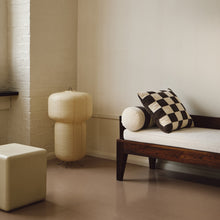 Load image into Gallery viewer, Lifestyle shot of cream and brown cotton corduroy checkered square cushion on daybed