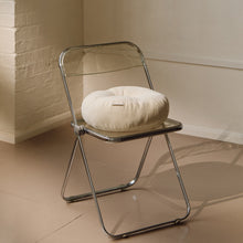 Load image into Gallery viewer, Lifestyle shot of cream cotton corduroy round cushion on chair