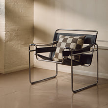 Load image into Gallery viewer, Lifestyle shot of cream and beige wool bouclé checkered square cushion on chair