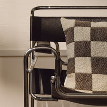 Load image into Gallery viewer, Lifestyle shot of cream and beige wool bouclé checkered square cushion on chair
